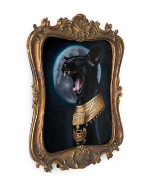 Side view of the decoratively framed original oil painting of Bastet yawning and wearing a golden scarab collar in front of a full moon by Jel Ena