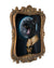 Full frontal view of the decoratively framed original oil painting of Bastet yawning and wearing a golden scarab collar in front of a full moon by Jel Ena